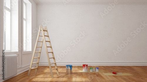 Leiter mit Farbe vor Wand im Raum