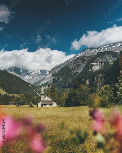 Church in Kandersteg Switzerland Alps Mountains with Flowers in Summer