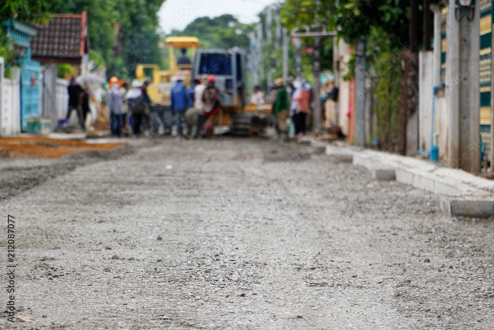 Many workers build asphalt roads. Gradient Blur. Many workers build asphalt roads. Gradient Blur.