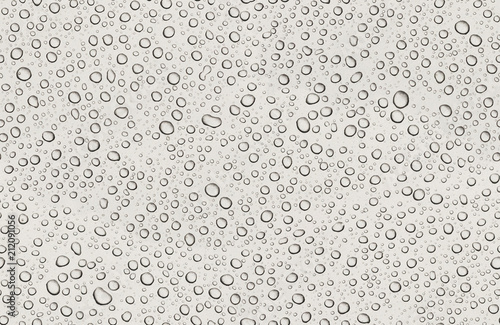 Seamless texture of water drops on grey metal background. Small various drops with shadows on gray metalic paint. Flat view. Clear abstract water background with copyspace