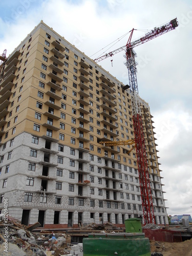 Construction of a multi-apartment residential building. The process of construction. Stages of construction.