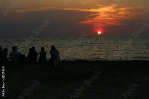silhouette all people meeting look sunset sky on beach