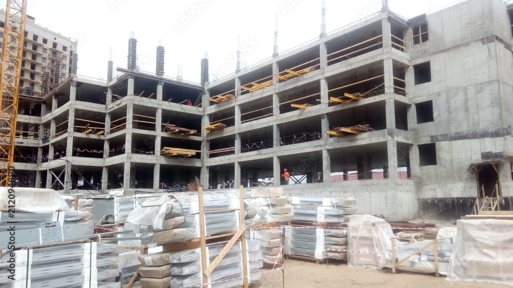 Construction of a multi-apartment residential building. The process of construction. Stages of construction. Construction of a multi-apartment residential building. The process of construction. Stages of construction.