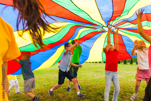 Unlimited joy under rainbow parachute