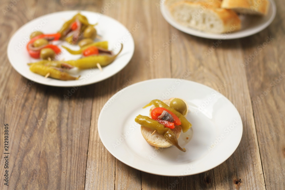 Basque banderilla made of peppers, olives and anchovies Basque banderilla made of peppers, olives and anchovies