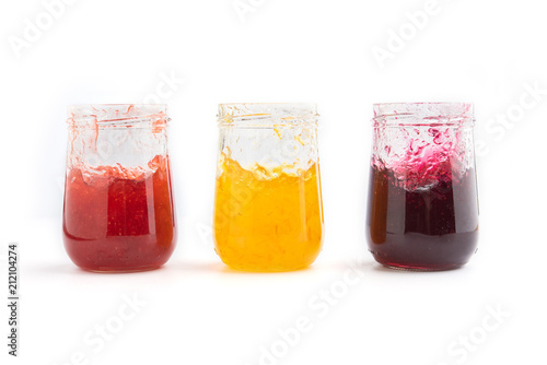 Wallpaper Mural Open jar of strawberry, orange and blueberries  jam on white background Torontodigital.ca