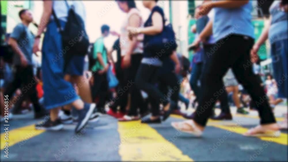 Anonymous pedestrians crossing intersection on busy road in central of big asian metropolis. Crowded crosswalk. Slow moving unrecognisable people at rush hour. Tracking shot. Anonymous pedestrians crossing intersection on busy road in central of big asian metropolis. Crowded crosswalk. Slow moving unrecognisable people at rush hour. Tracking shot.