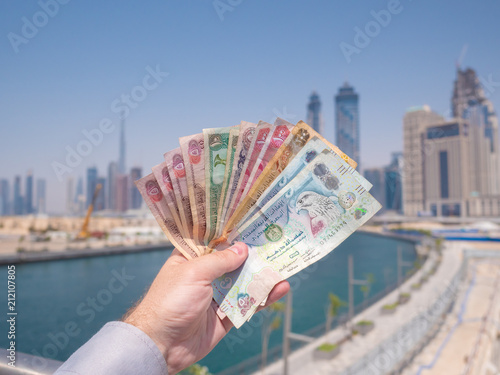 Photography A man holds the money of the United Arab Emirates. Dirham.