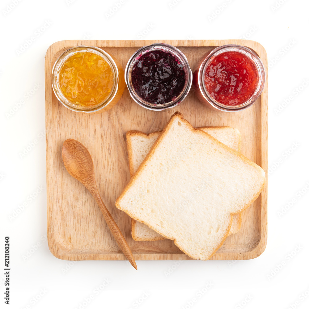 Toast sandwiches with strawberry, orange and blueberries jam isolated on white background, top view