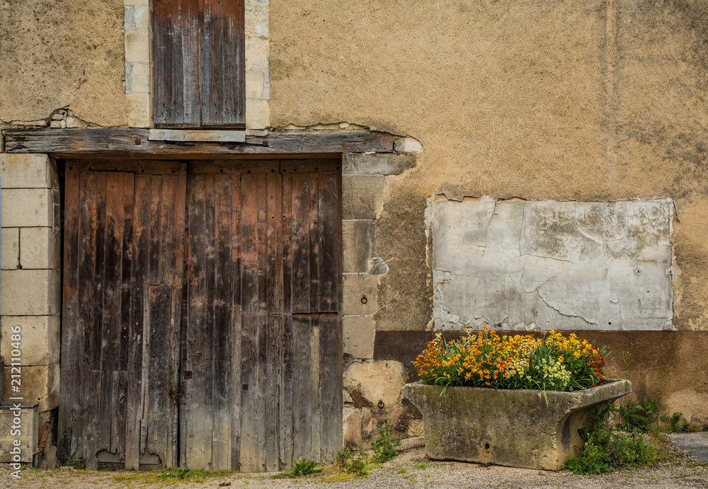 Planter and flowers in the beautiful town of Chablis, Burgundy, France Planter and flowers in the beautiful town of Chablis, Burgundy, France