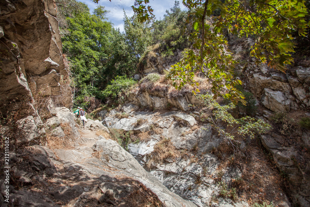 Beautiful narrow hike path alongside the creak at Santa Anita Canyon, Angeles National Forest, San Gabriel Mountain Range near Los Angeles, California, USA Beautiful narrow hike path alongside the creak at Santa Anita Canyon, Angeles National Forest, San Gabriel Mountain Range near Los Angeles, California, USA