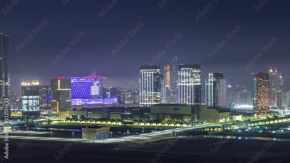 Buildings on Al Reem island in Abu Dhabi night timelapse from above.