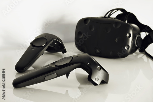 A closeup of a virtual reality controllers on a white background