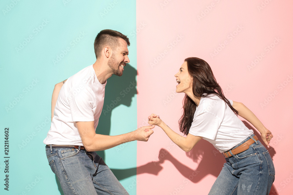 A couple of young man and woman dancing hip-hop at studio. A couple of young man and woman dancing hip-hop at studio.