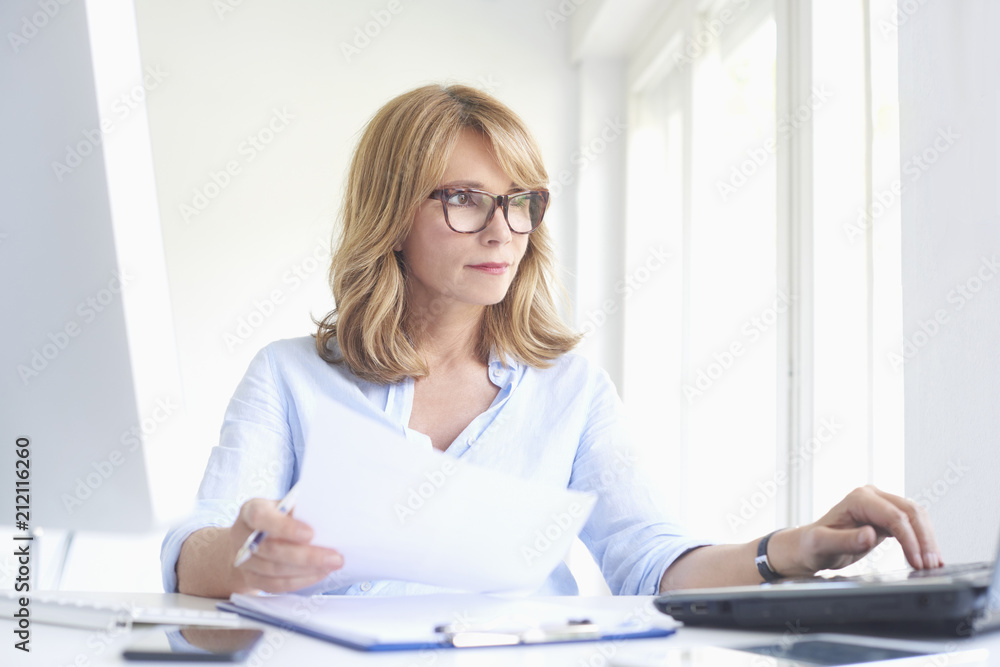 Professional woman working at the office Professional woman working at the office