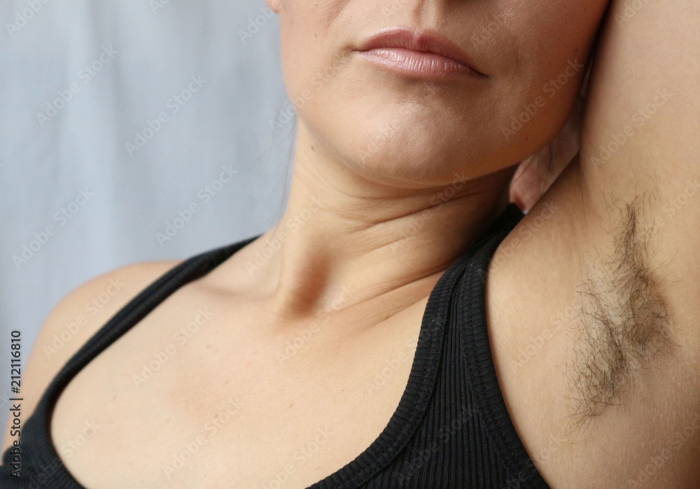 Woman with armpit hair, hair growth, depilation or new natural trend  unshaved hair concept. Stock Photo | Adobe Stock