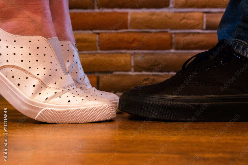 the girl is on toes and kisses a man the girl is on toes and kisses a man