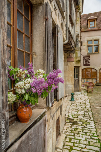 Fototapeta Naklejka Na Ścianę i Meble -  View down a street in the beautiful town of Noyers sur Serein in Burgundy