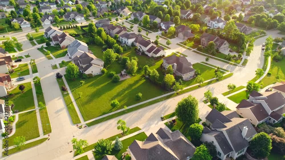 Serene, idyllic neighborhoods, homes, Summertime aerial view, early morning. Serene, idyllic neighborhoods, homes, Summertime aerial view, early morning.