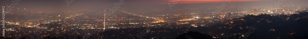 Night skyline of Los Angels viewed from Griffith Observatory in panorama.