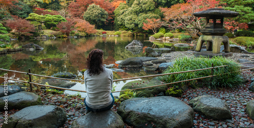 Canvas Print Woman is relaxing in a Japanese garden in Tokyo