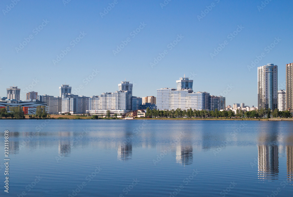 The city of Minsk, a bright day. Houses, water, sky. Landscape
