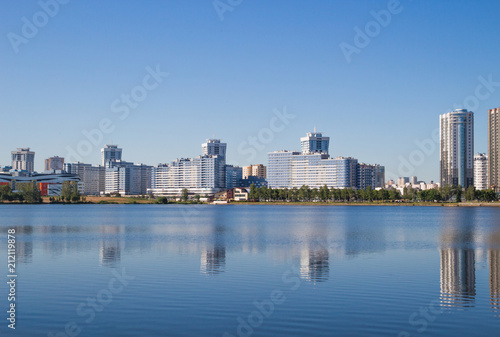 The city of Minsk, a bright day. Houses, water, sky. Landscape