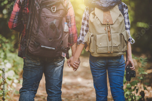 Lovers young hiking in the forest, Travel relax, Holiday and vacation, Love and relations, Travel hiking, Hiking concept.