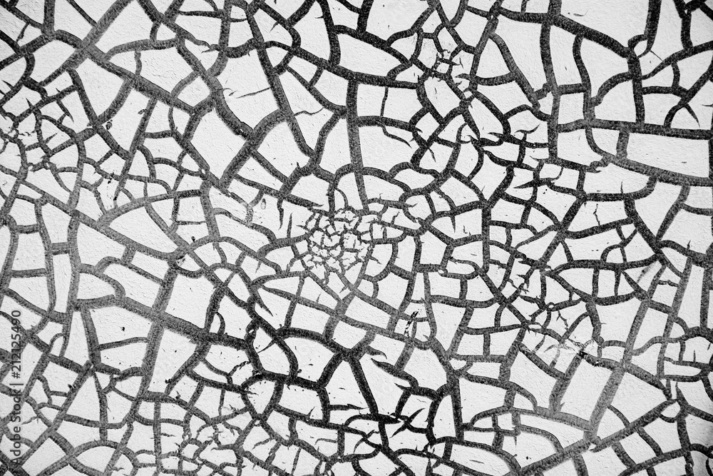 Obraz premium detail of cracked paint on wall. black and white