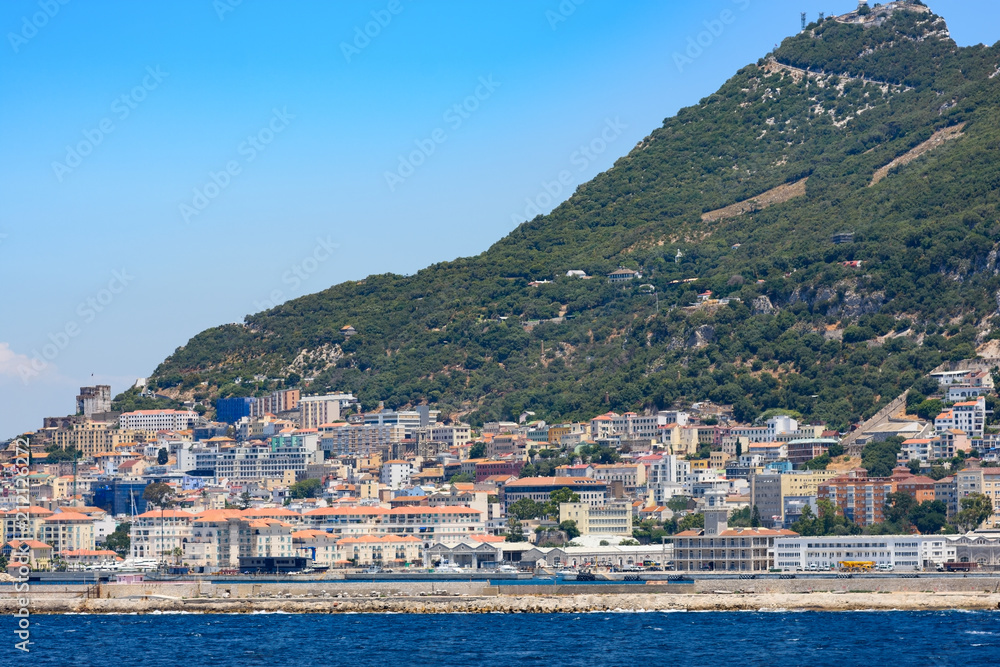 Day view to Gibraltar rock from sea, architecture of Gibraltar