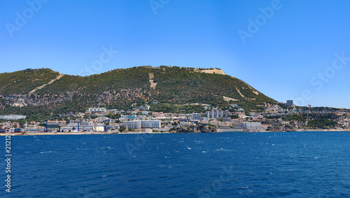 Day view to Gibraltar rock from sea, architecture of Gibraltar