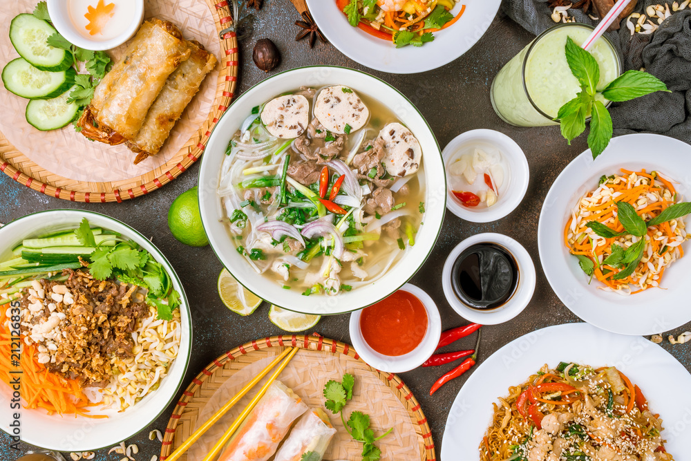 Assorted asian dinner, vietnamese food. Pho ga, pho bo, noodles, spring rolls Assorted asian dinner, vietnamese food. Pho ga, pho bo, noodles, spring rolls