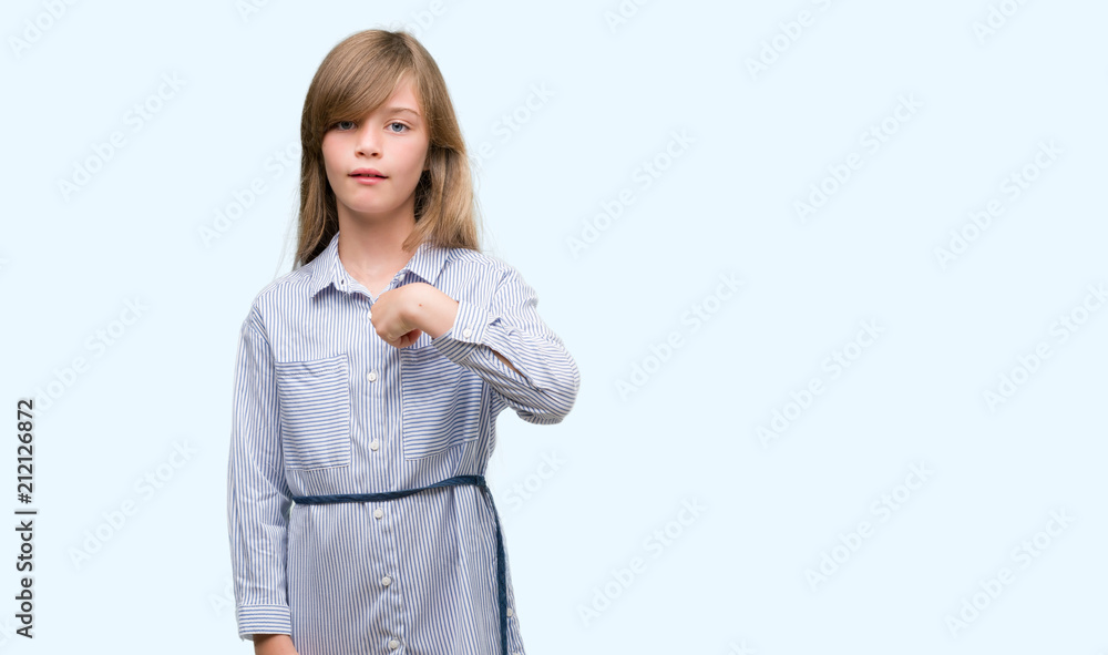 Young blonde toddler wearing blue shirt with surprise face pointing finger to himself Young blonde toddler wearing blue shirt with surprise face pointing finger to himself