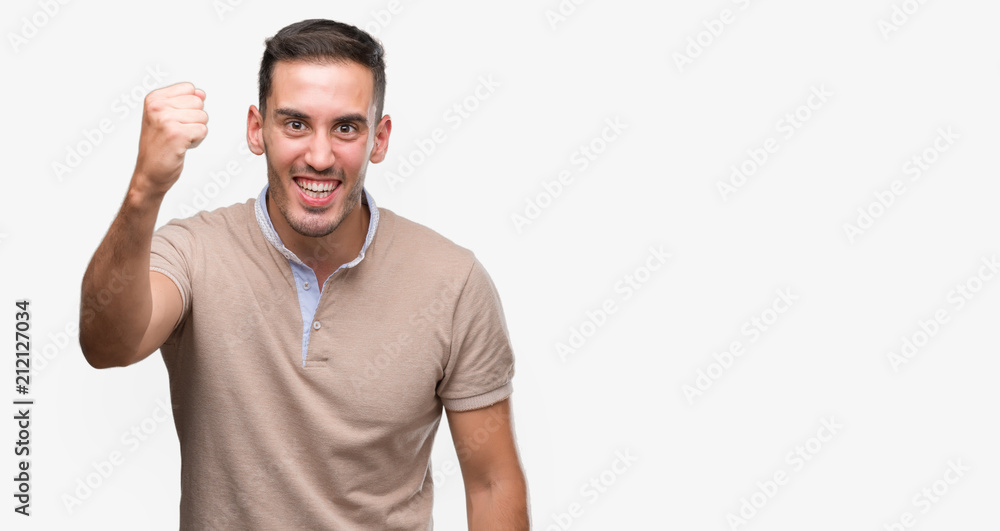 Handsome young man annoyed and frustrated shouting with anger, crazy and yelling with raised hand, anger concept Handsome young man annoyed and frustrated shouting with anger, crazy and yelling with raised hand, anger concept