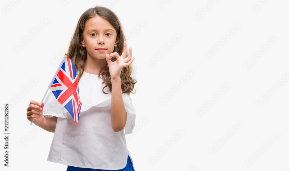 Brunette hispanic girl holding flag of United Kingdom doing ok sign with fingers, excellent symbol Brunette hispanic girl holding flag of United Kingdom doing ok sign with fingers, excellent symbol