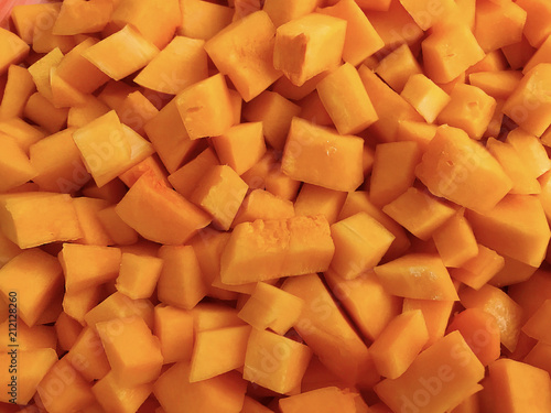 Background - bright, orange pumpkin, sliced.