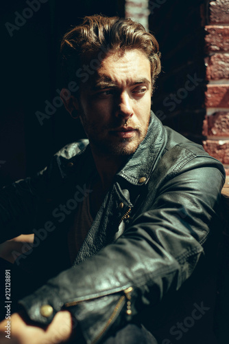 Fashion portrait of an attractive man inside industrial building