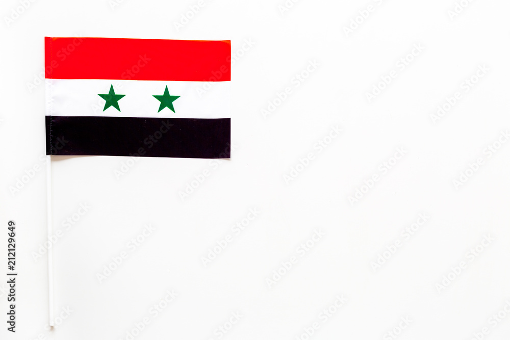 Syrian flag concept. small flag on white background top view copy space Syrian flag concept. small flag on white background top view copy space