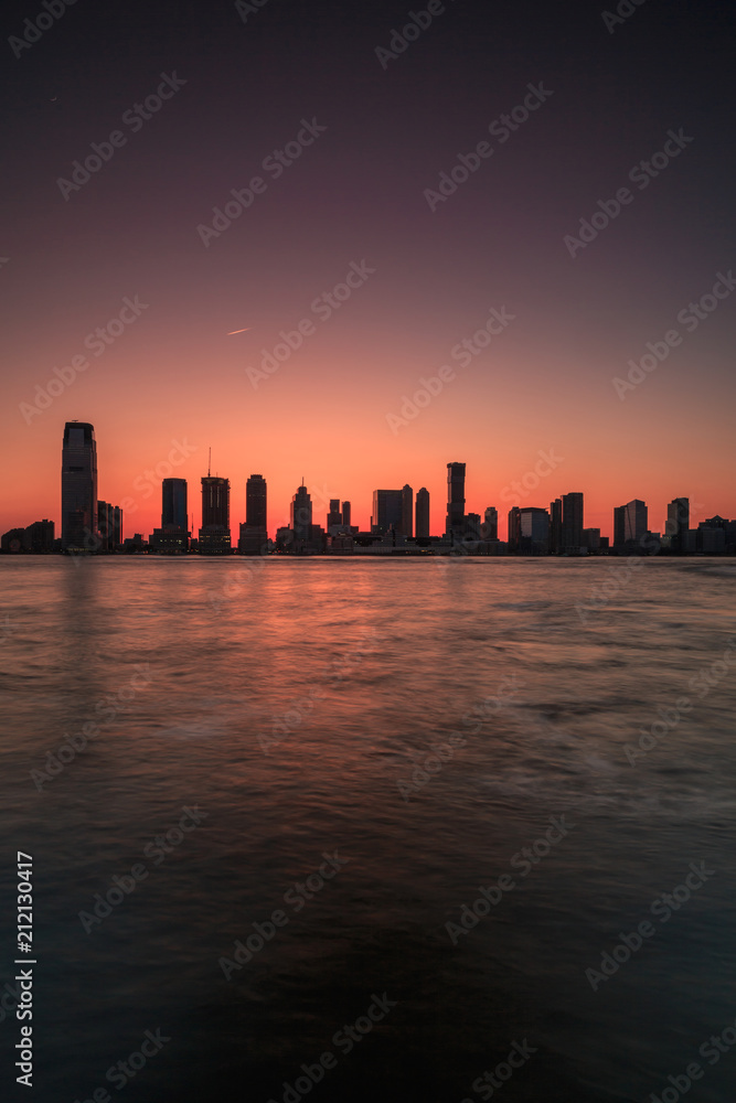 Jersey city view from Hudson river at sunset