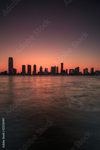 Jersey city view from Hudson river at sunset