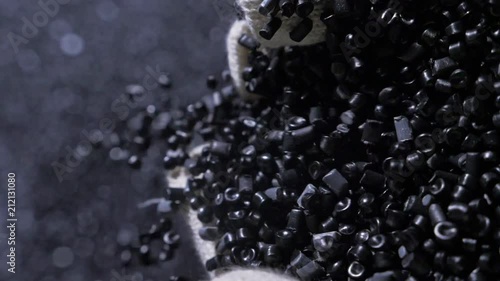 Plastic black gray granulated crumb. Manufacture of plastic water pipes of the factory. Process of making plastic tubes on the machine tool with the use of water and air pressure.