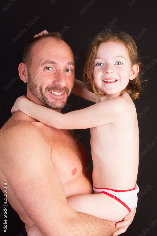 family father carries his child girl in his arms family father carries his child girl in his arms