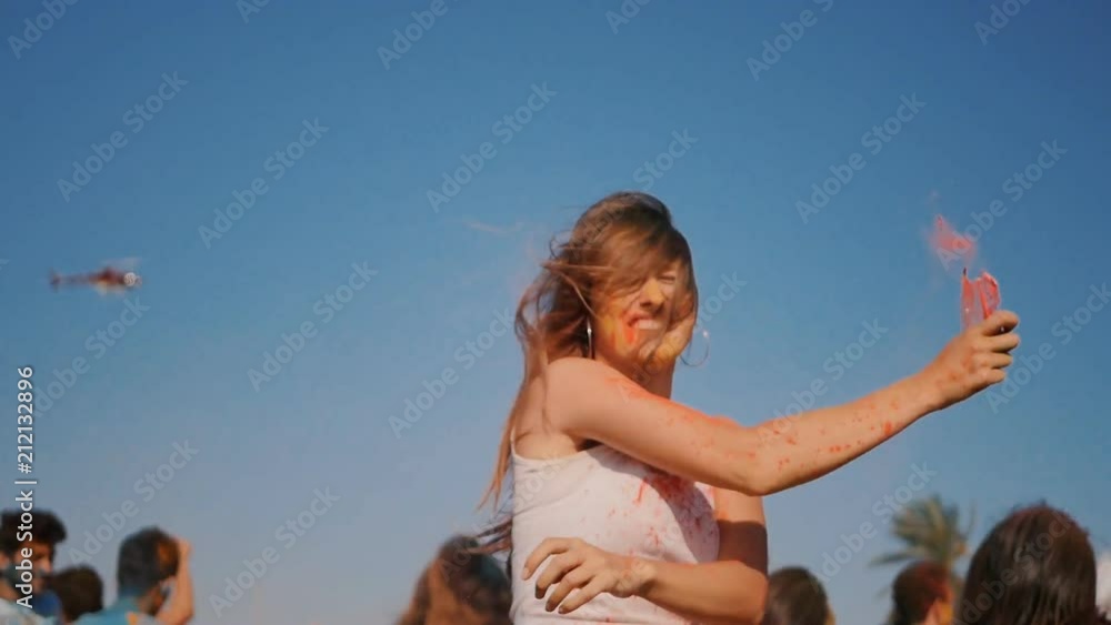 Closeup of young woman having fun on the Holi Festival Closeup of young woman having fun on the Holi Festival