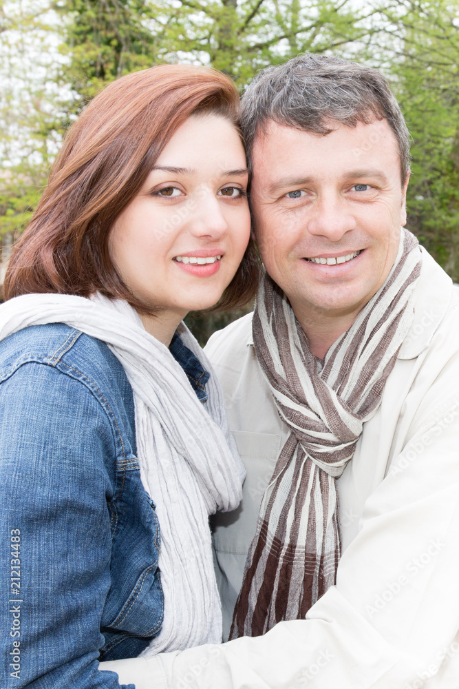 couple in love hug together outdoors couple in love hug together outdoors