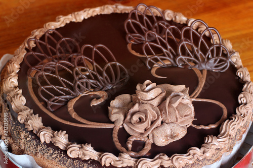 Chocolate cake on a wooden table photo