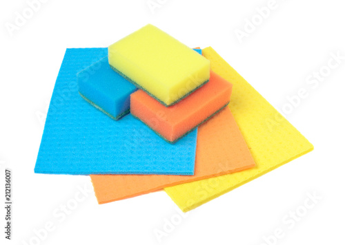 Sponge for washing dishes and rags for a table on a white background