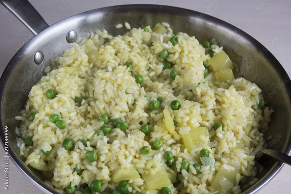 Vegetable risotto with saffron and green peas Vegetable risotto with saffron and green peas