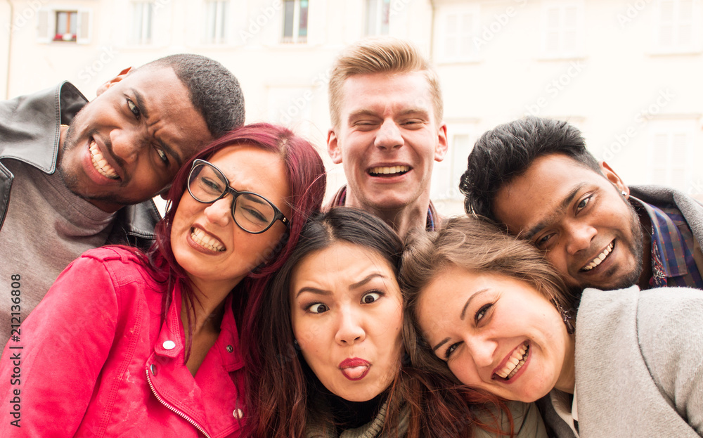happy international team of college students of multi-ethnic origins, best friends making funny faces for a selfie photo. happy international team of college students of multi-ethnic origins, best friends making funny faces for a selfie photo.