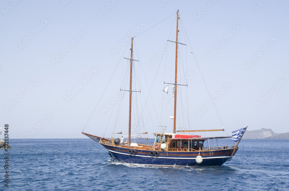 Wooden ship for trip near Santorini island Wooden ship for trip near Santorini island