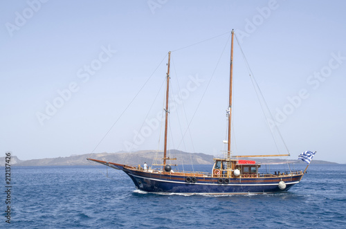 Wooden ship for trip near Santorini island